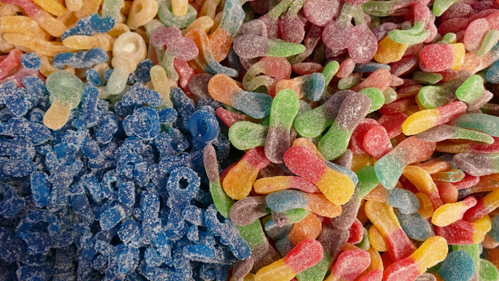 a close up of a pile of colorful candy