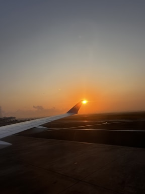 A welcoming image of a private aircraft at sunset.