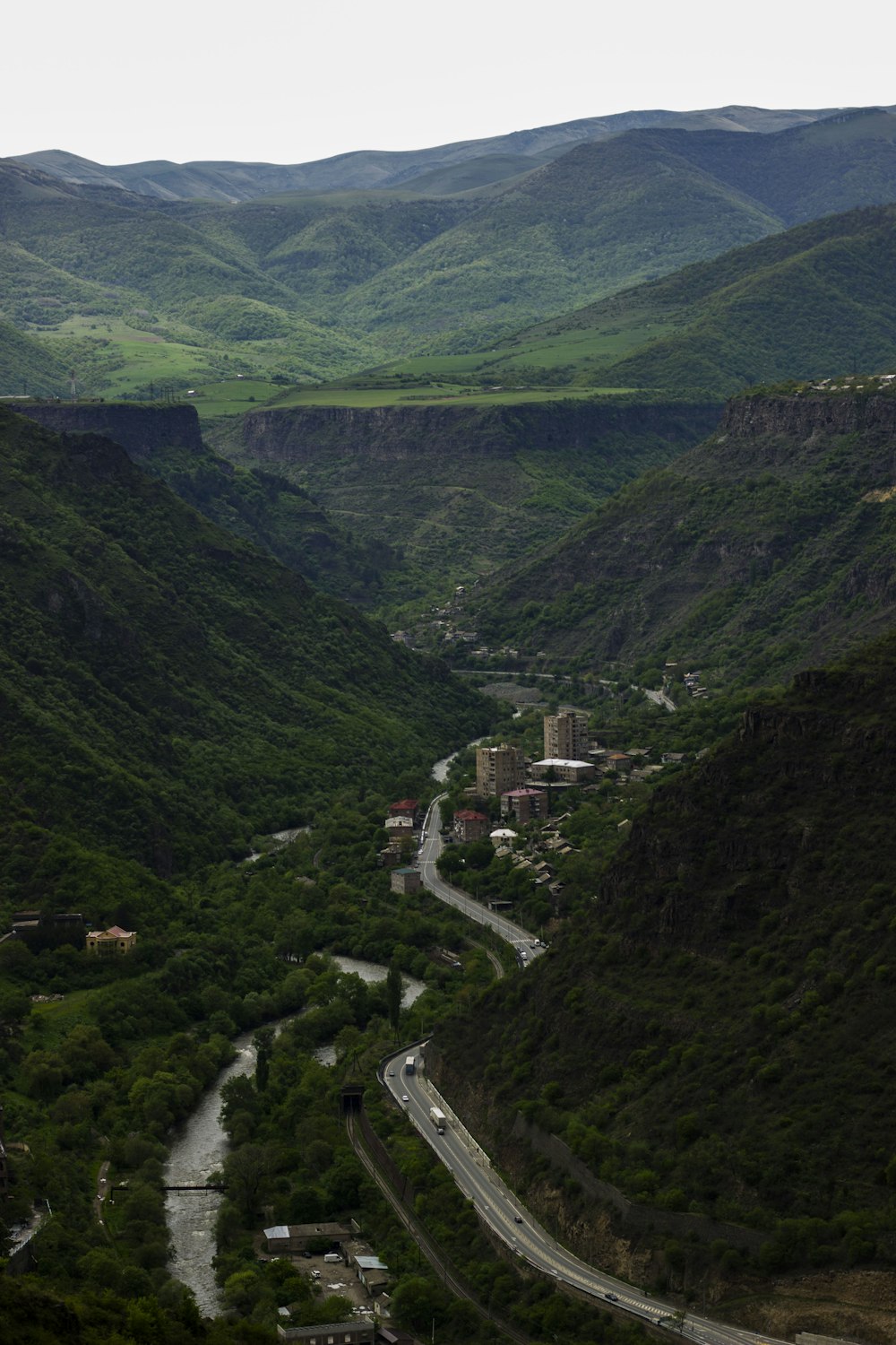 a river running through a lush green valley