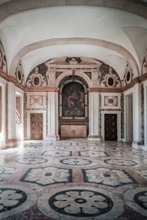 a large room with a painting on the wall