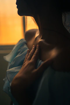 a woman with her hands on her chest