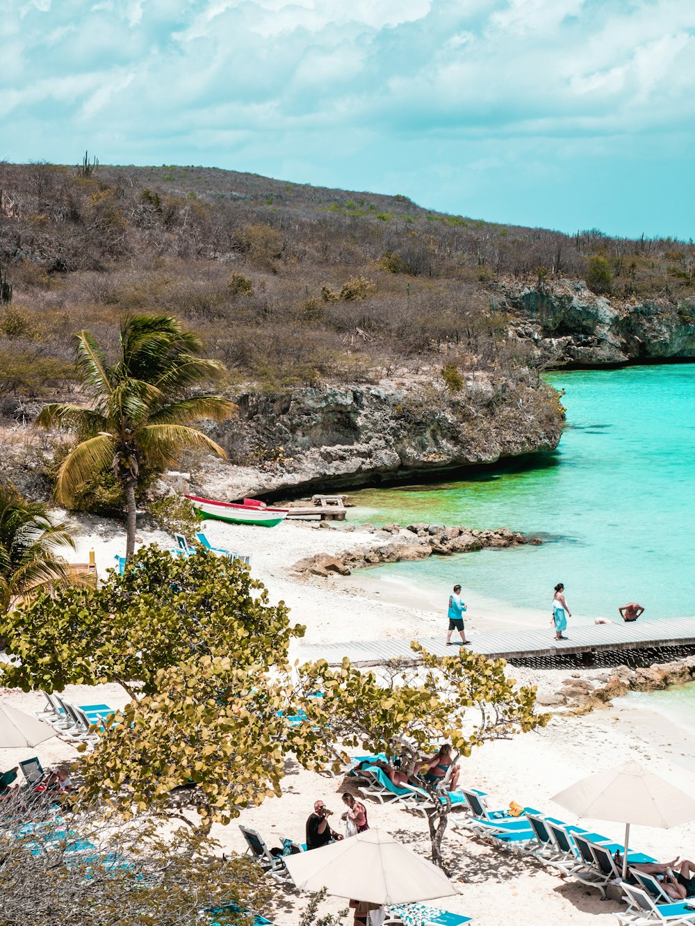 a couple of people that are standing on a beach