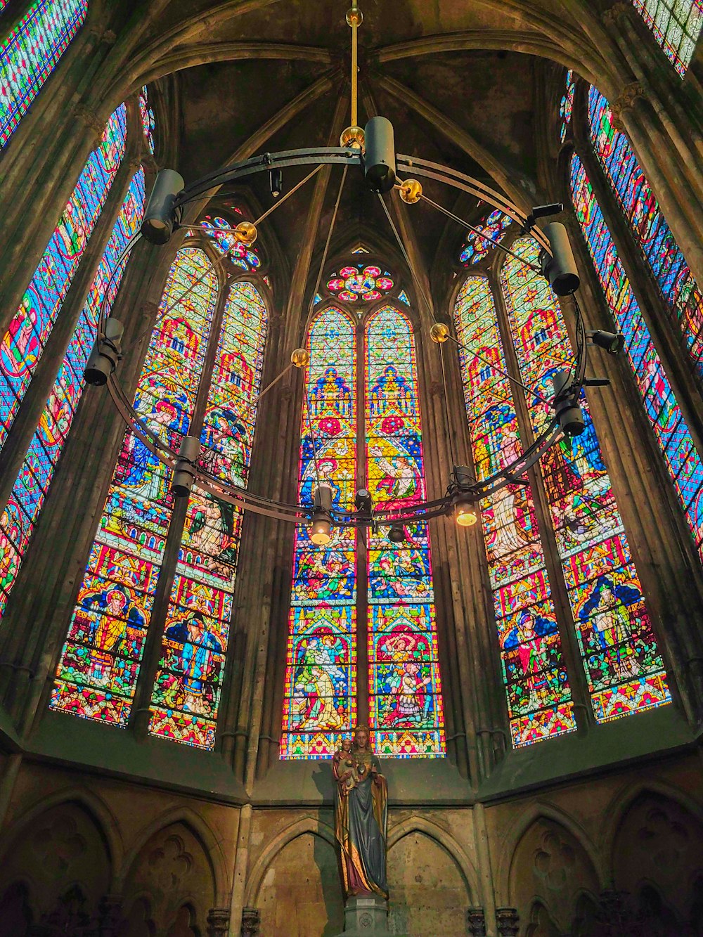 a large stained glass window inside of a church