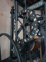 An intricate mixed-media piece featuring clock gears and cultural motifs from around the world, representing the passage of time across continents.