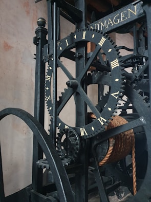 An intricate mixed-media piece featuring clock gears and cultural motifs from around the world, representing the passage of time across continents.