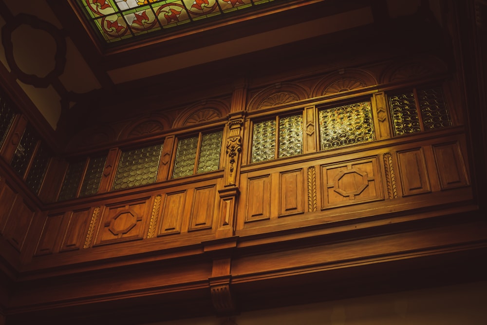 a wooden door with a stained glass window above it