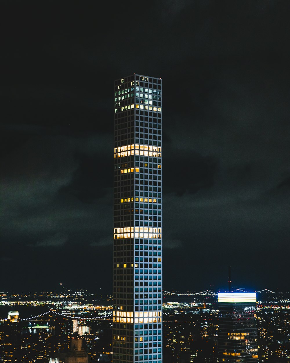 a very tall building lit up at night