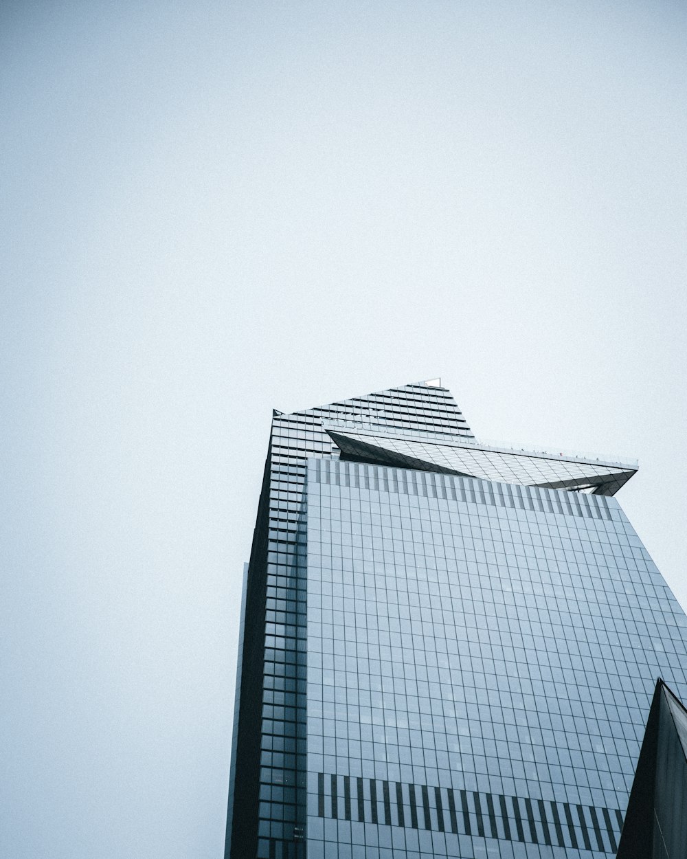 a very tall building with a sky background