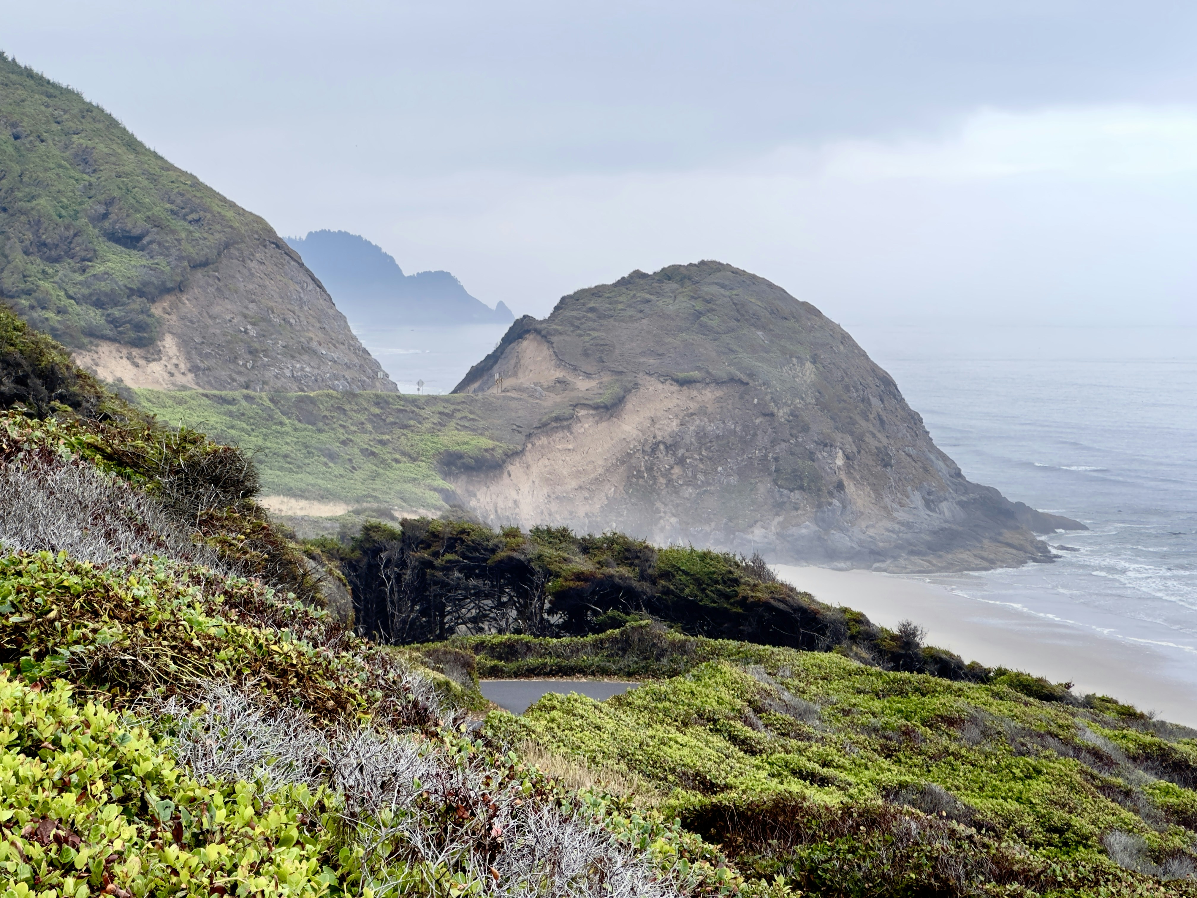 A scenic view of the ocean and mountains