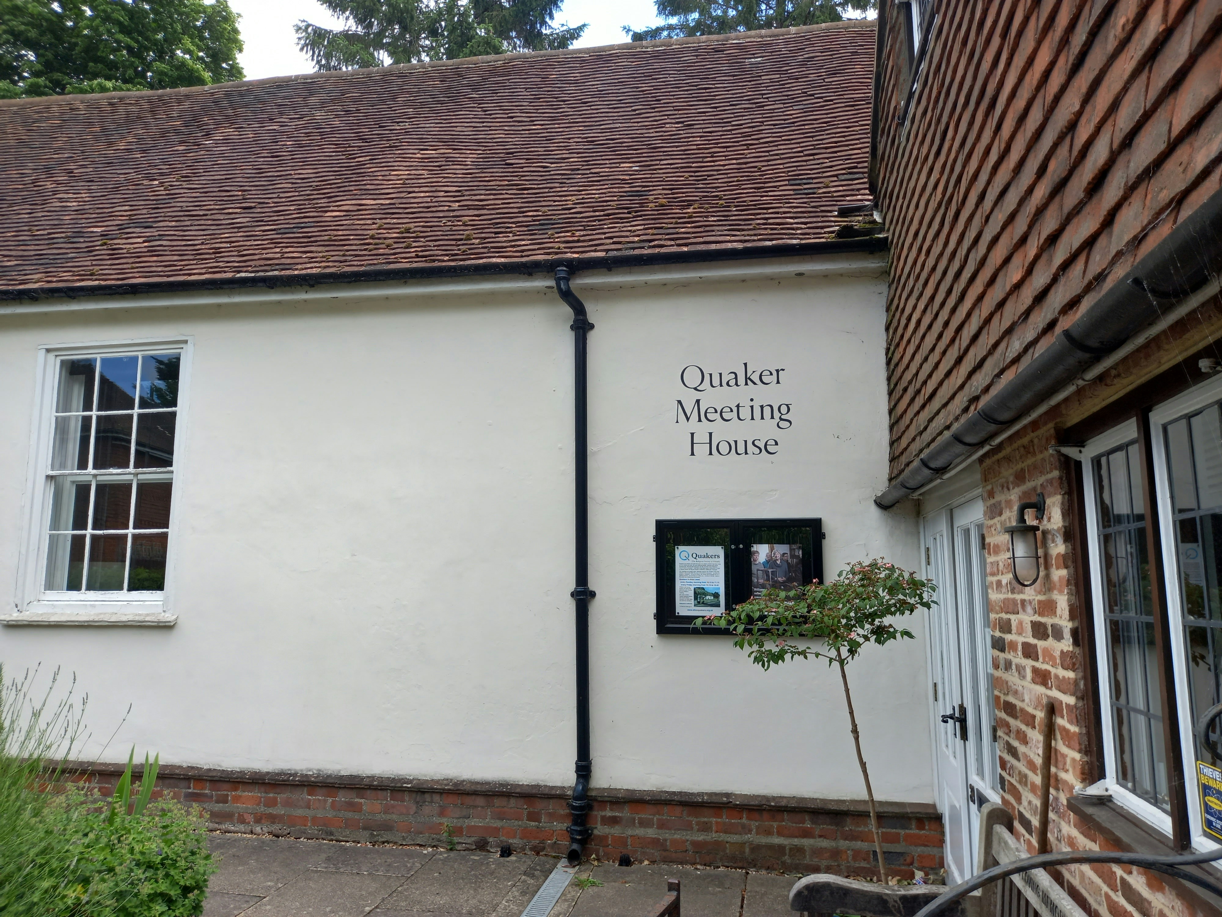 a white building with a sign on the side of it