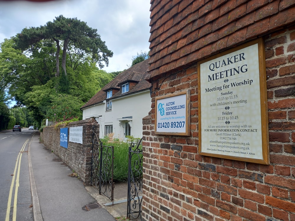 a brick building with a sign on the side of it