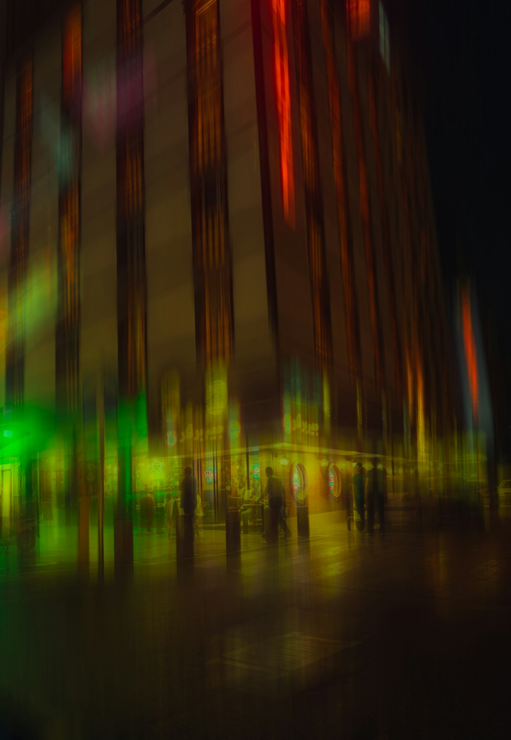 a blurry photo of a city street at night