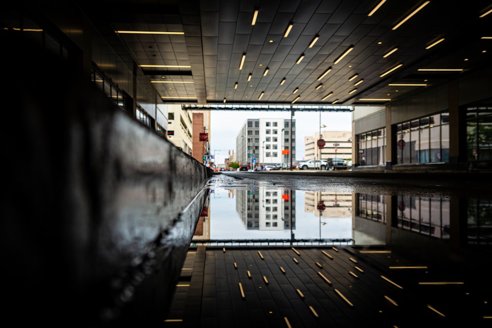 a reflection of a building in a pool of water