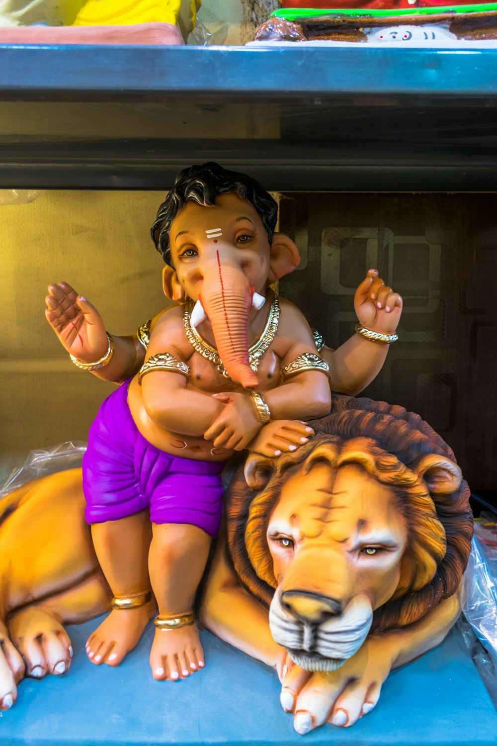 a statue of a man sitting on top of a lion