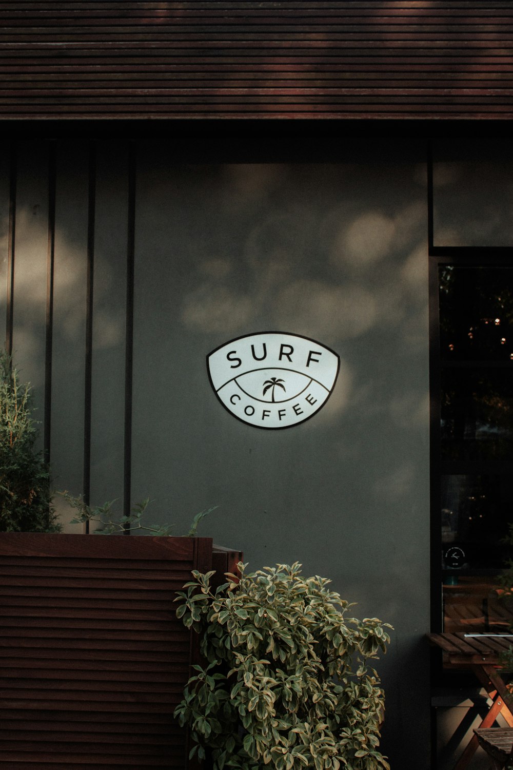 a surf coffee sign on the side of a building