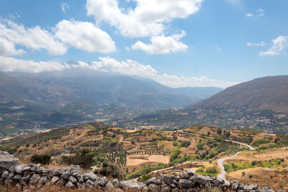 a scenic view of a valley and mountains