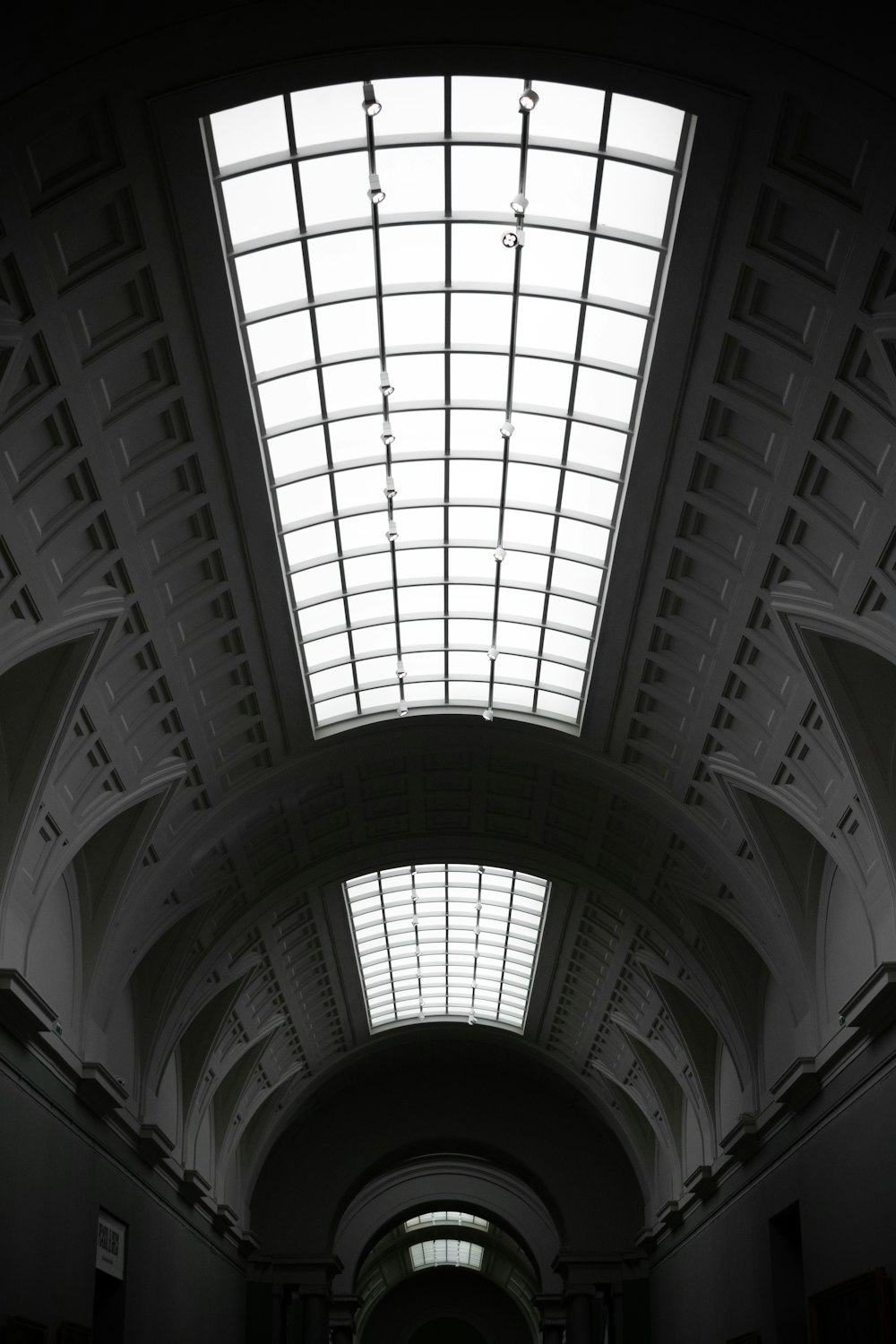 a long hallway with a skylight above it