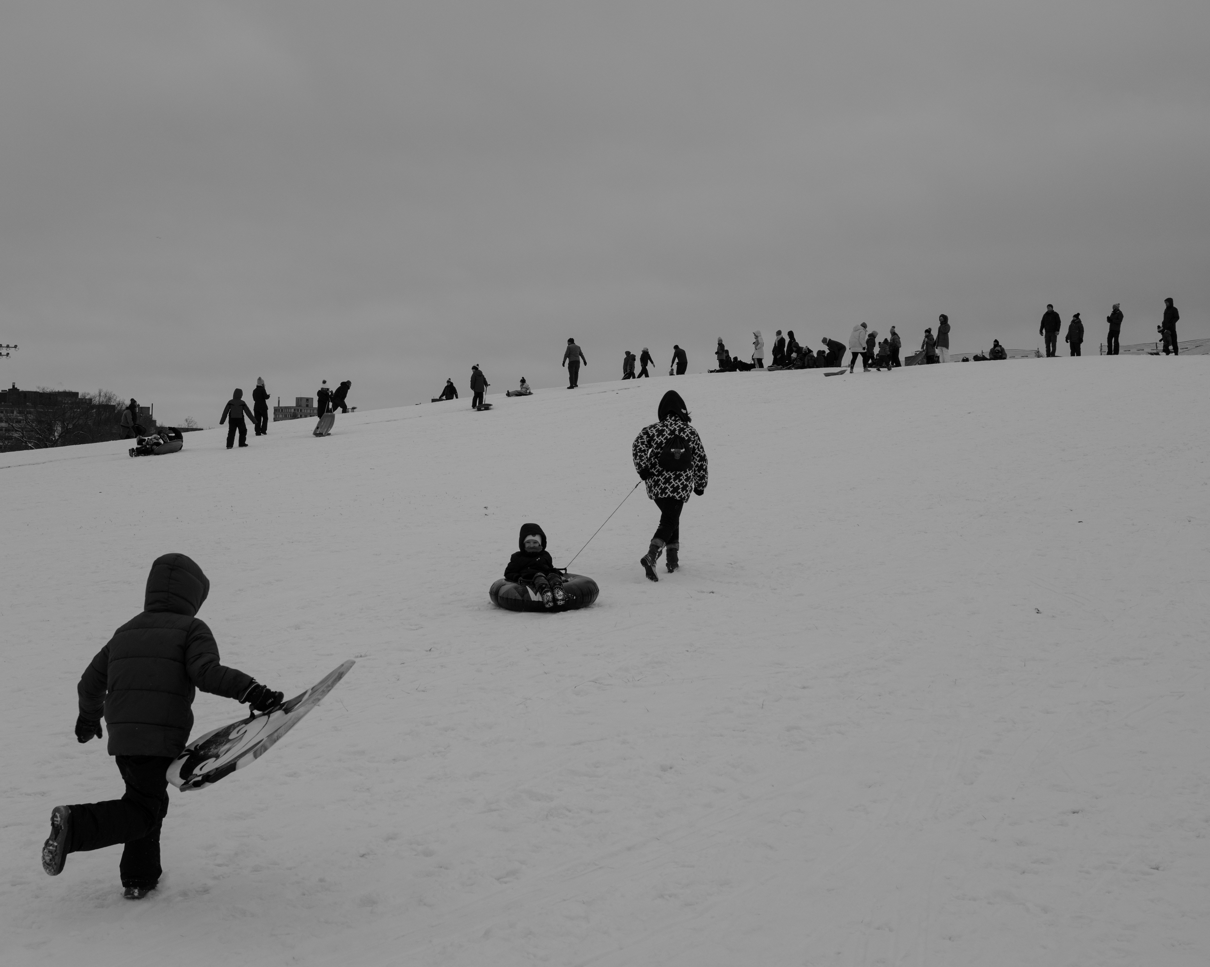 a group of people standing on top of a snow covered slope