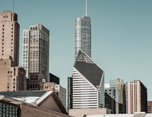 Skyline view of urban real estate developments blending classic and contemporary architecture.