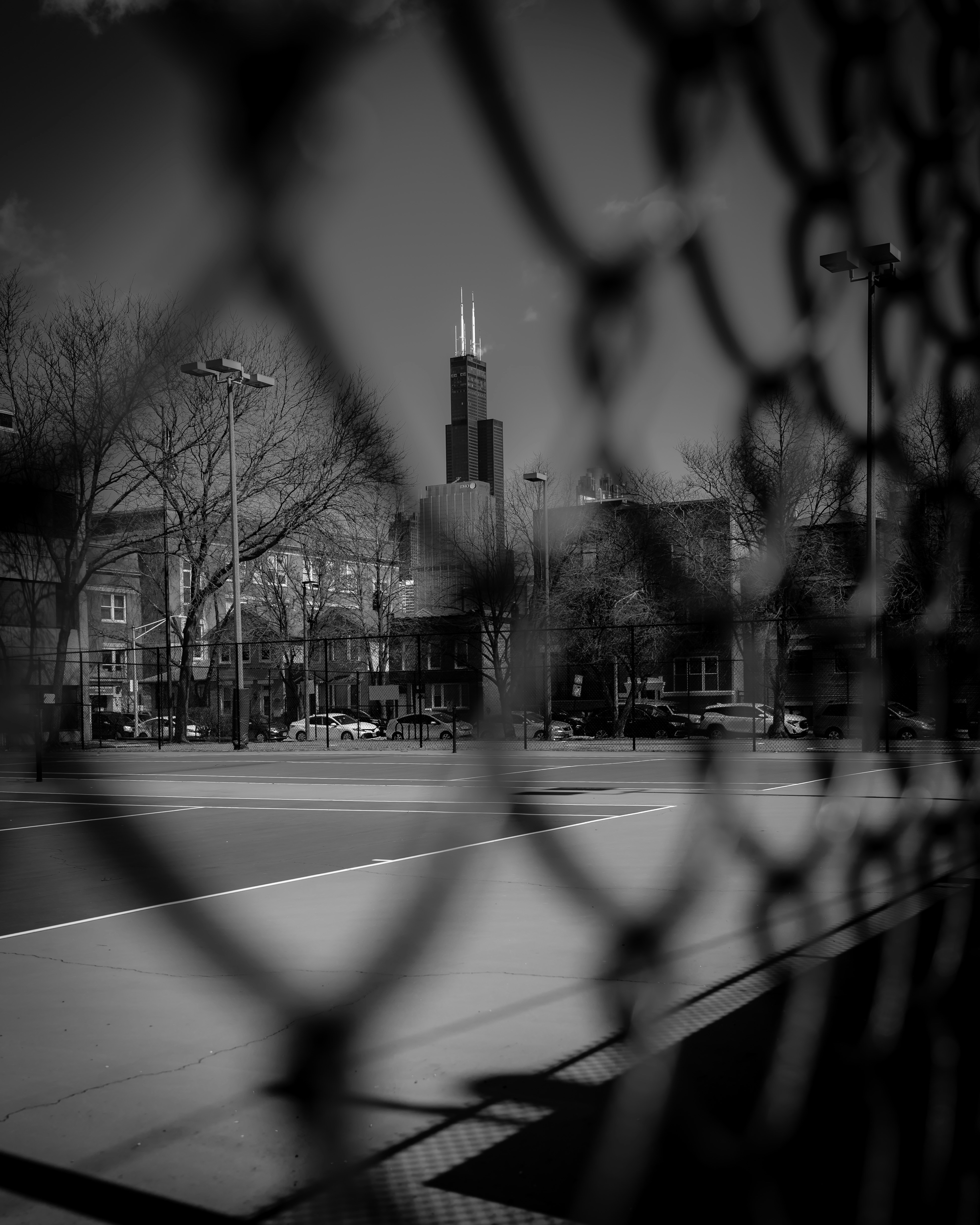 a black and white photo of a tennis court