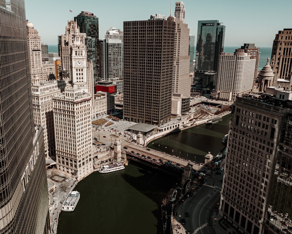 an aerial view of a river running through a city