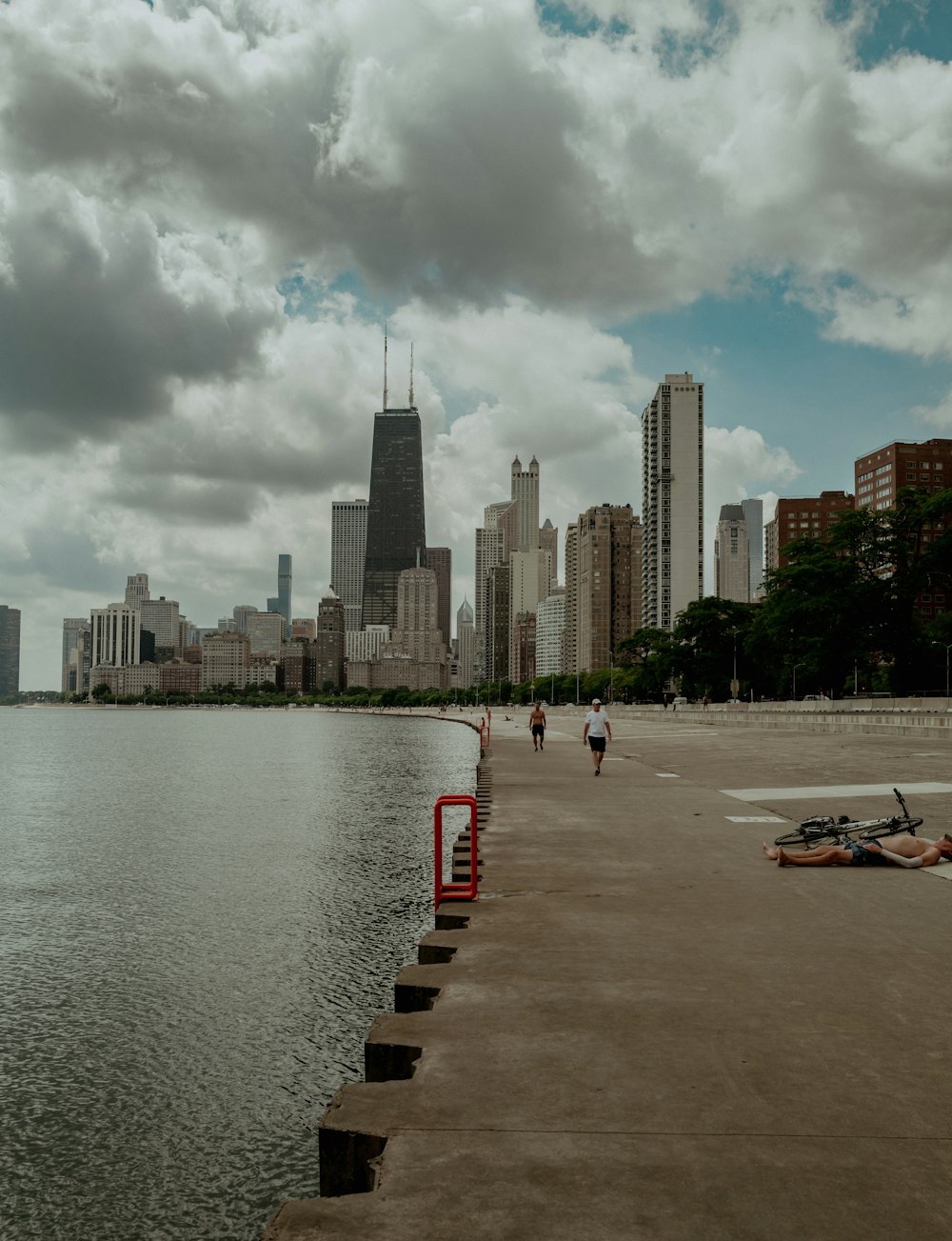 a body of water with a city in the background