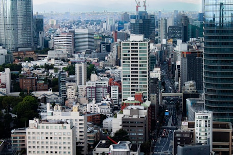 A bustling cityscape featuring high-rise apartments and commercial buildings.