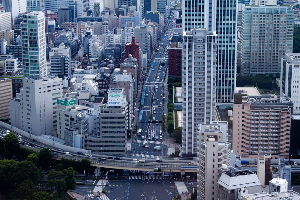 an aerial view of a city with tall buildings