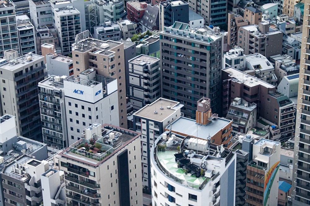 an aerial view of a city with tall buildings