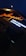 A brightly lit sign in Russian characters is shown under night lighting, with the main word illuminated in orange neon and additional text below in white light. Adjacent to the sign, there is a cluster of flowers visible, enhancing the ambient outdoor setting.