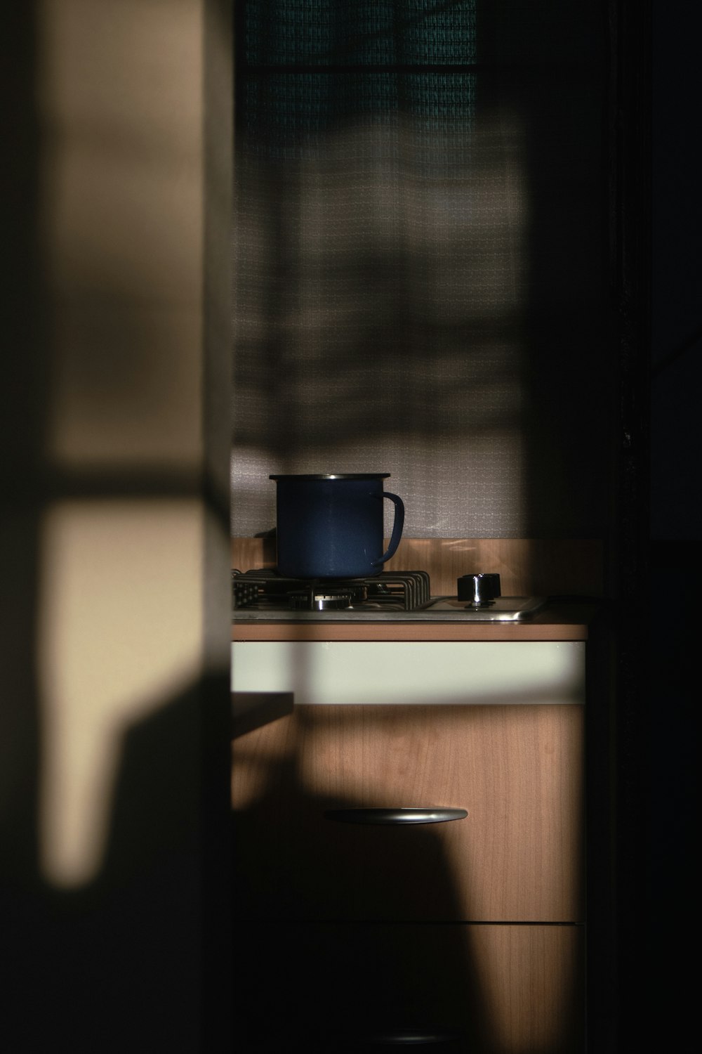 a kitchen counter with a pot on top of it