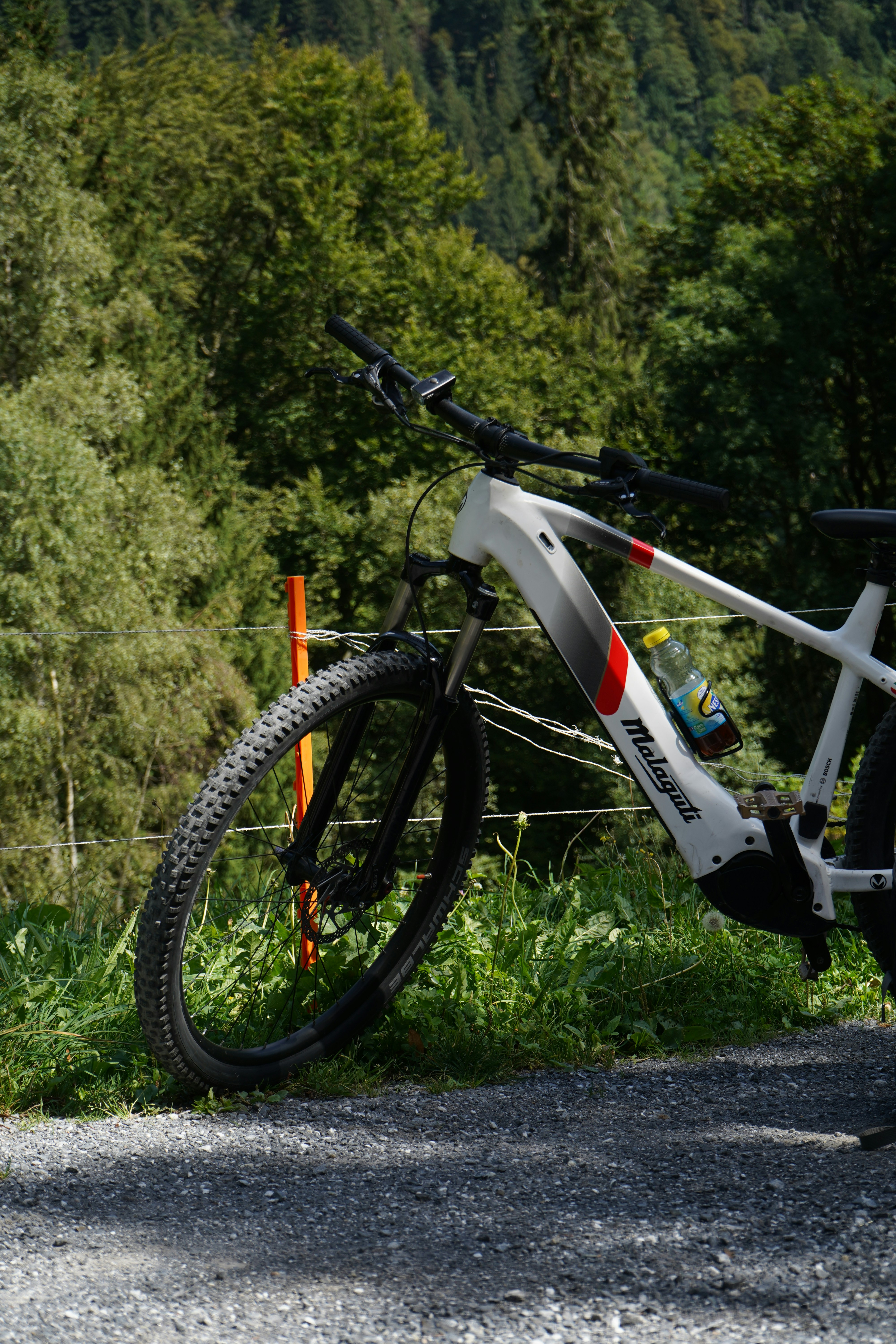 a bike parked on the side of a road