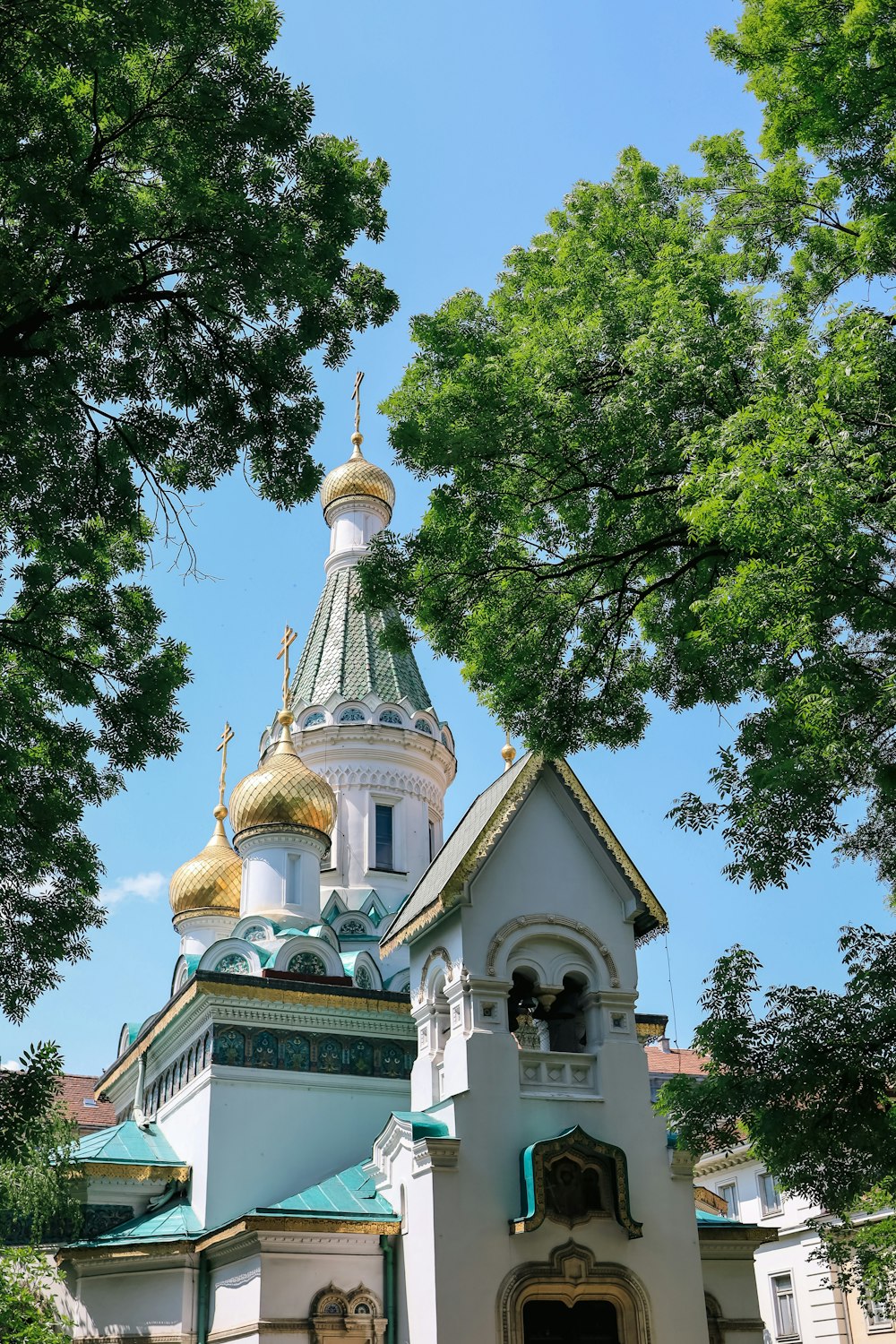 a church with a steeple and a bell tower