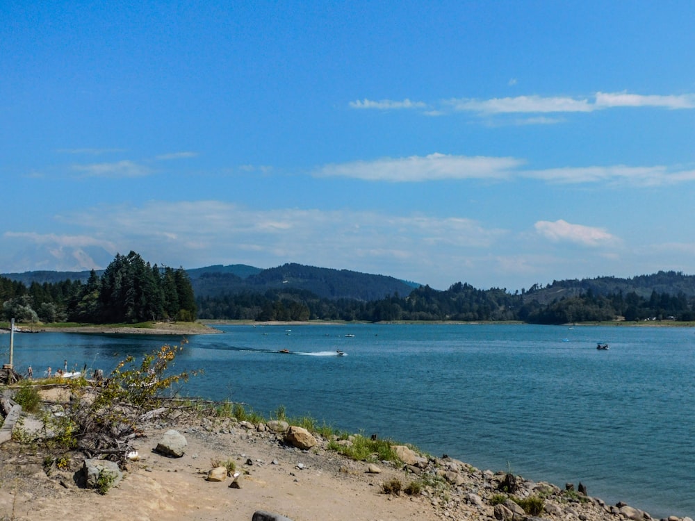 a body of water with a boat in the distance