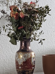A close-up of a premium artistic vase with intricate details and luxurious finish displayed in a stylish room.