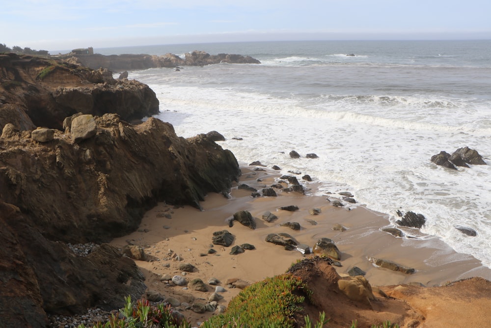 a view of the ocean from a rocky cliff