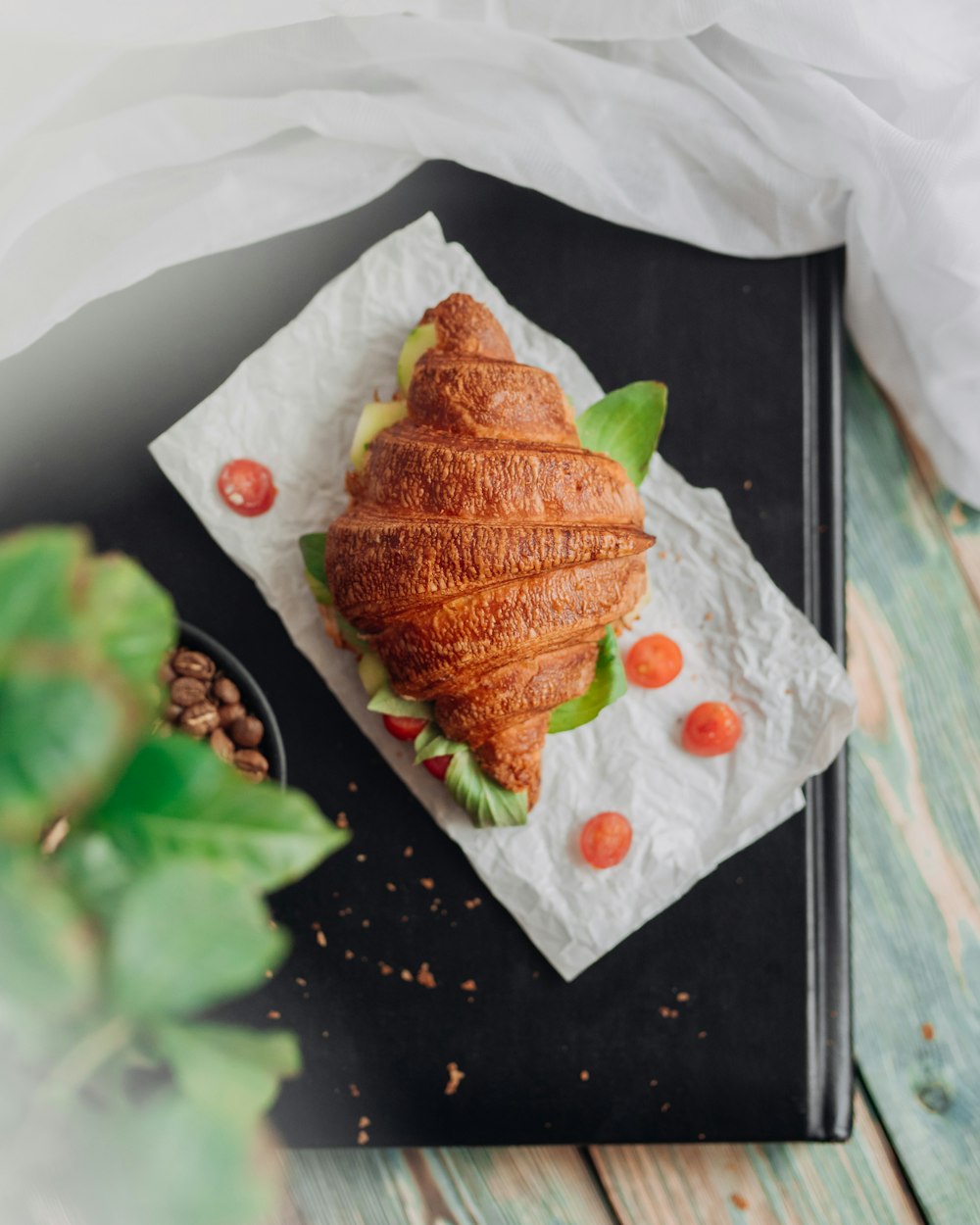 a croissant shaped like a heart on a napkin