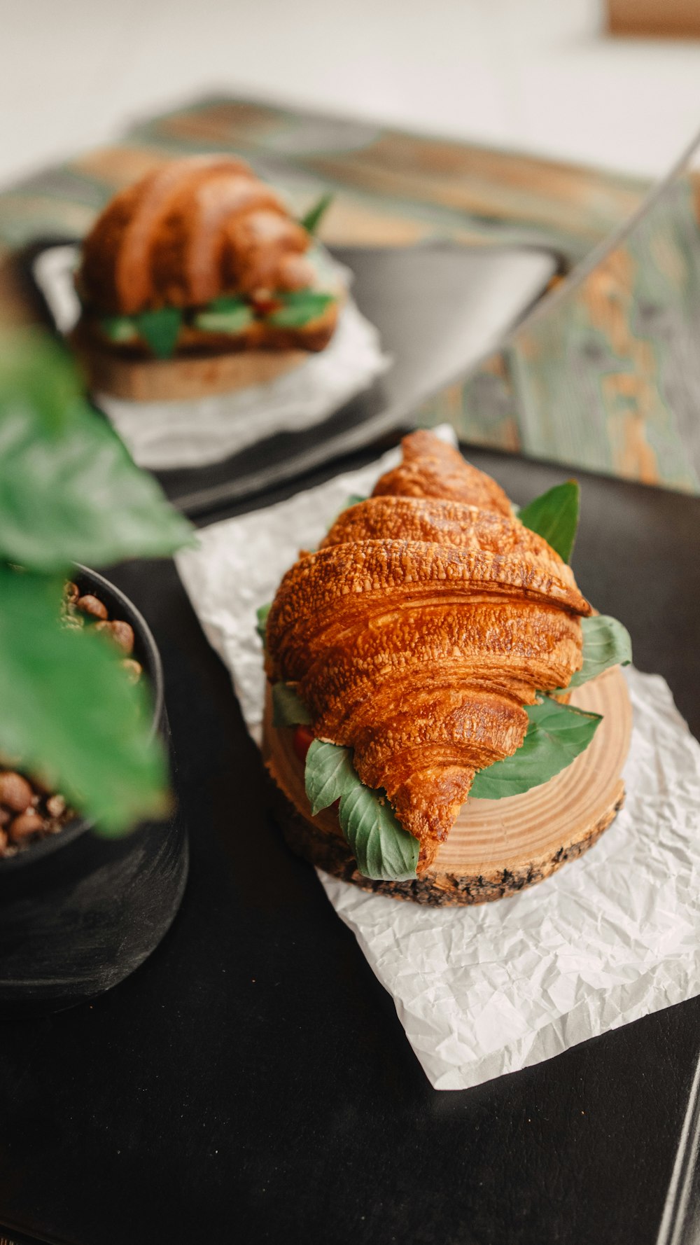 a croissant sandwich sitting on top of a table