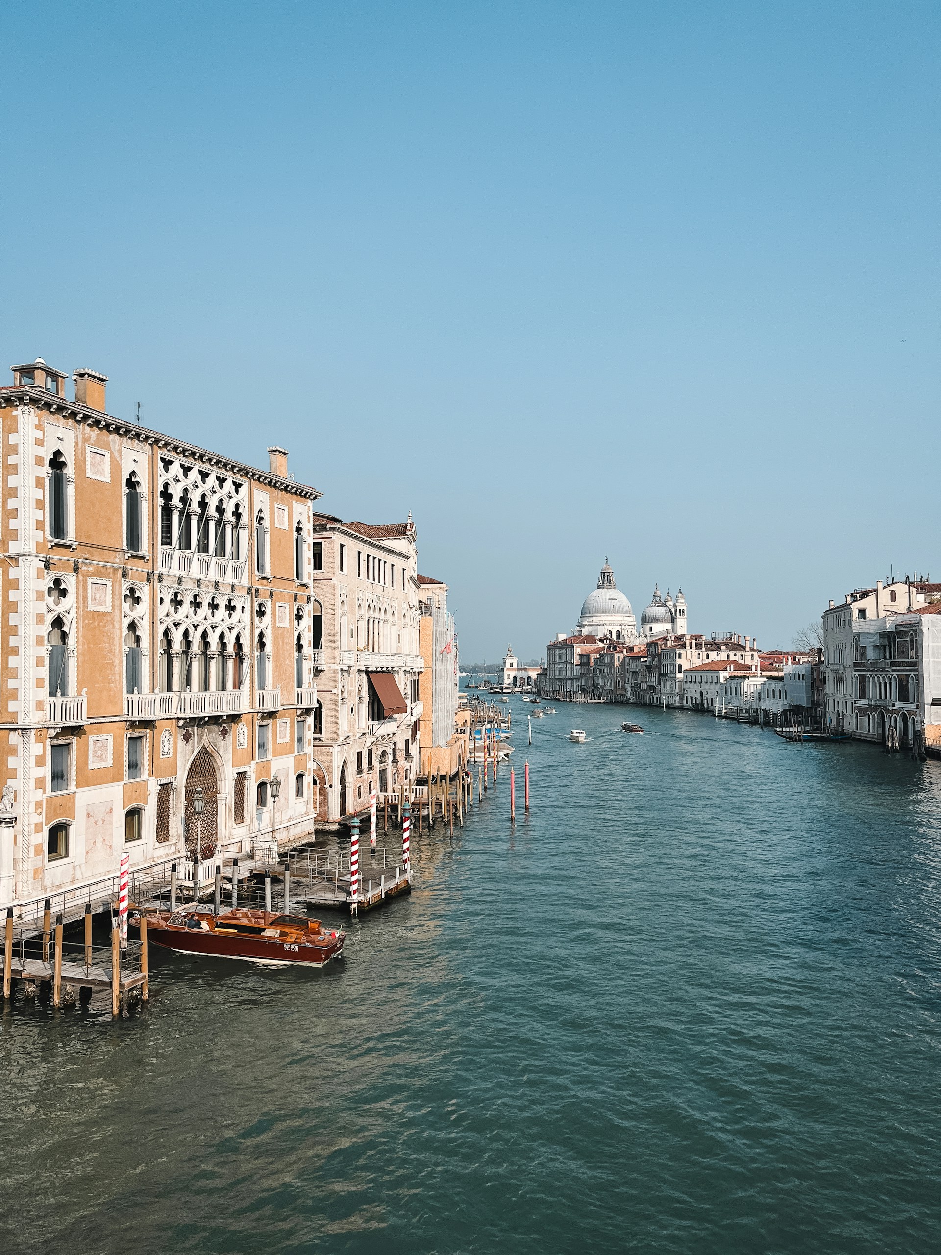 a view of a waterway with buildings and boats in the water
