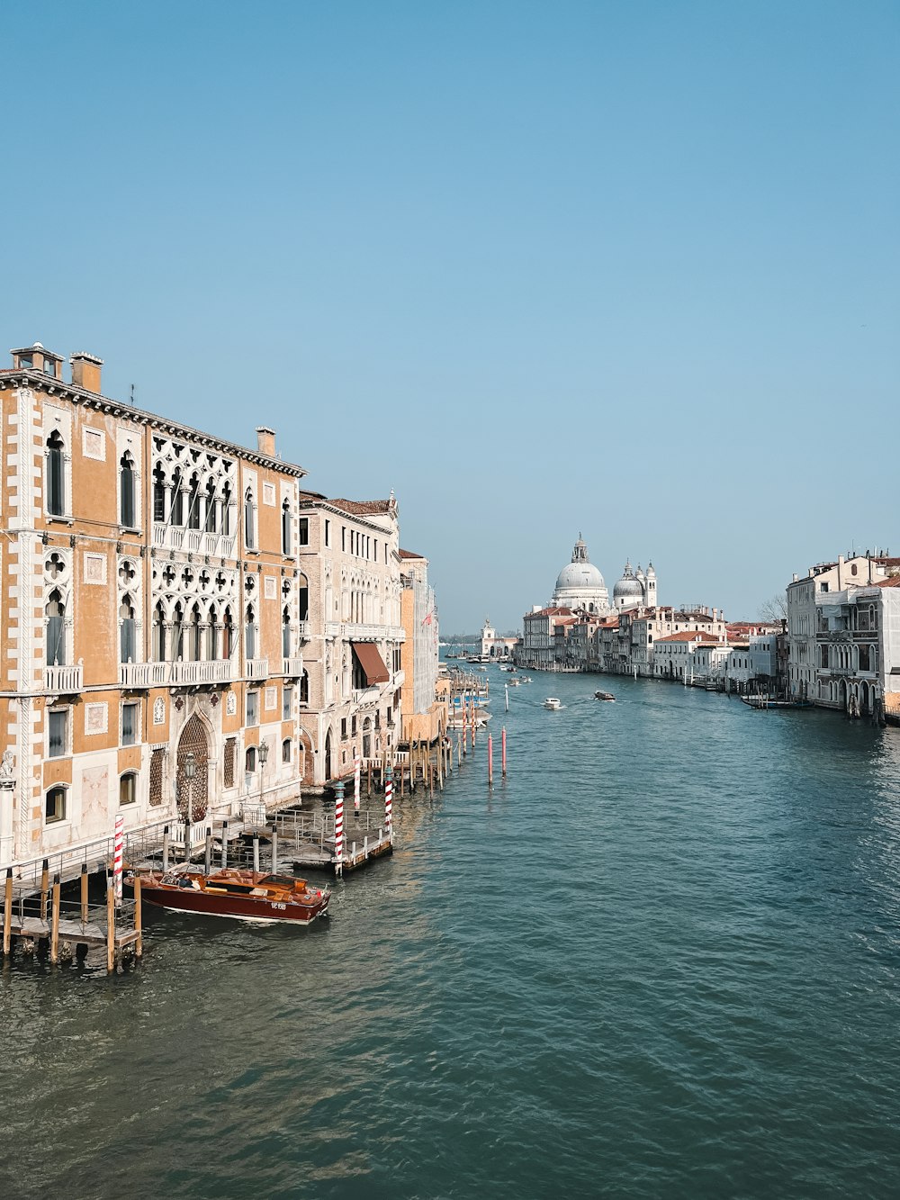 a view of a waterway with buildings and boats in the water