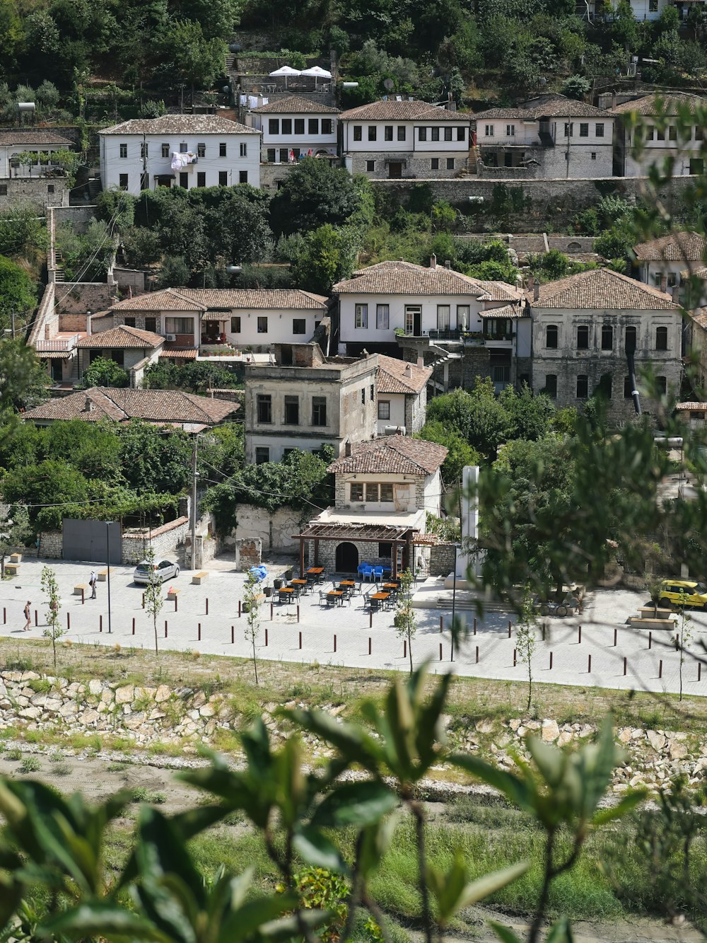 an aerial view of a town on a hill