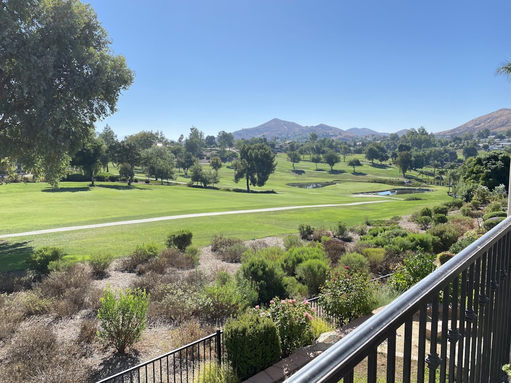 a view of a golf course from a balcony