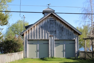 A classic wooden garage door complementing a vintage home exterior.