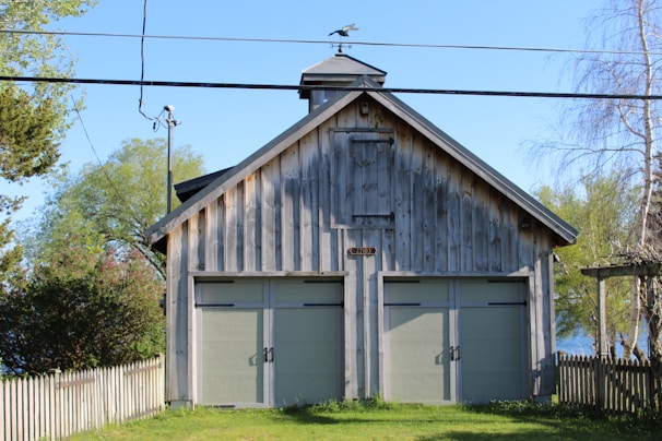 A classic wooden garage door complementing a vintage home exterior.