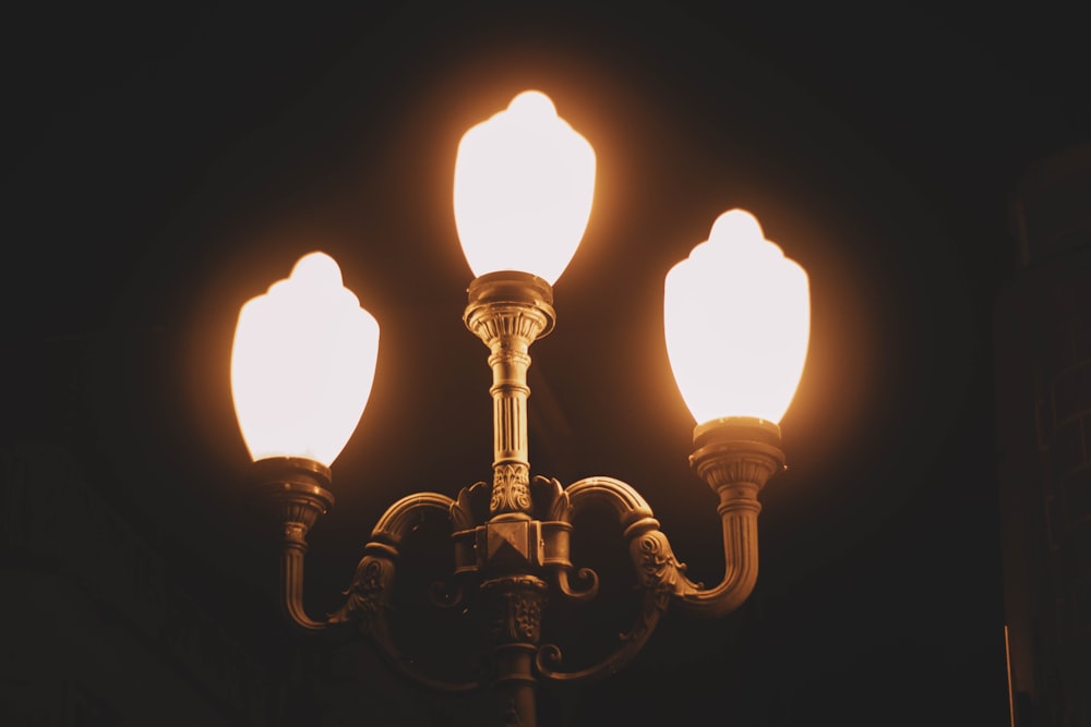 a close up of a street light in the dark