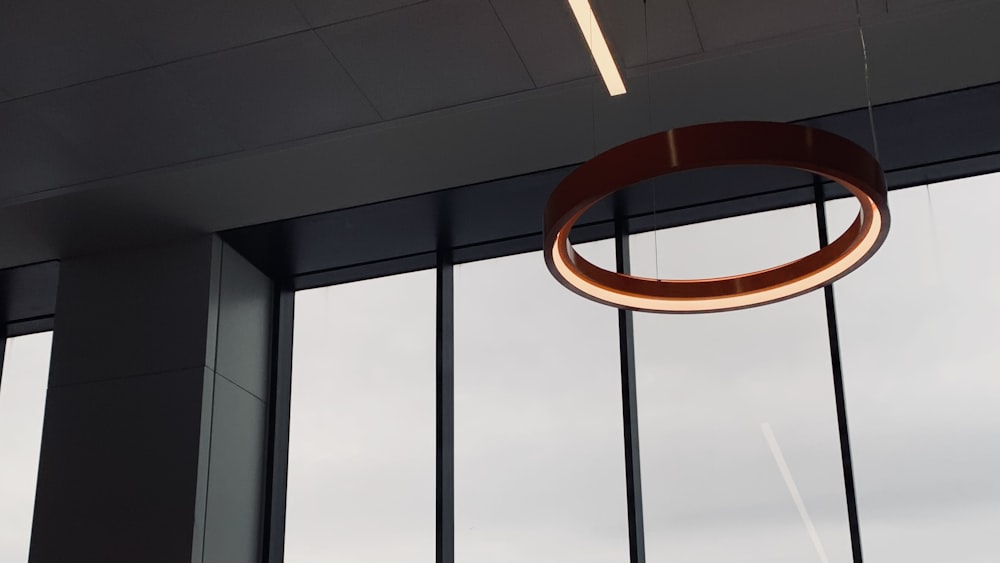 a circular light fixture hanging from a ceiling