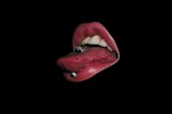 A vibrant photo of a lip piercing with a decorative stud.