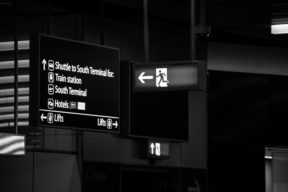 a black and white photo of a street sign