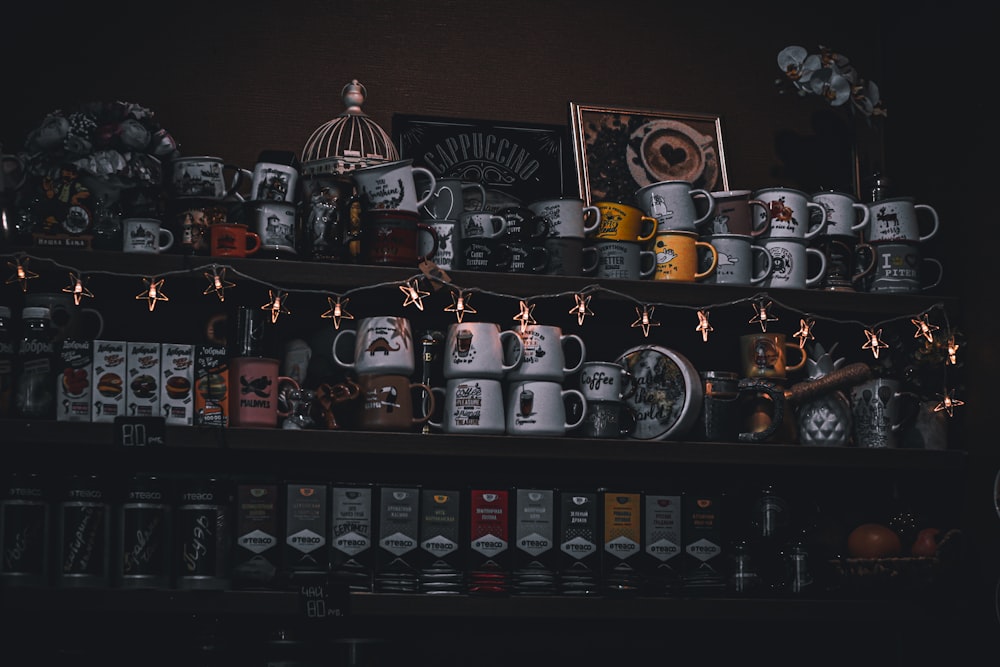a shelf filled with lots of coffee mugs