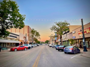 a street with cars parked on both sides of it